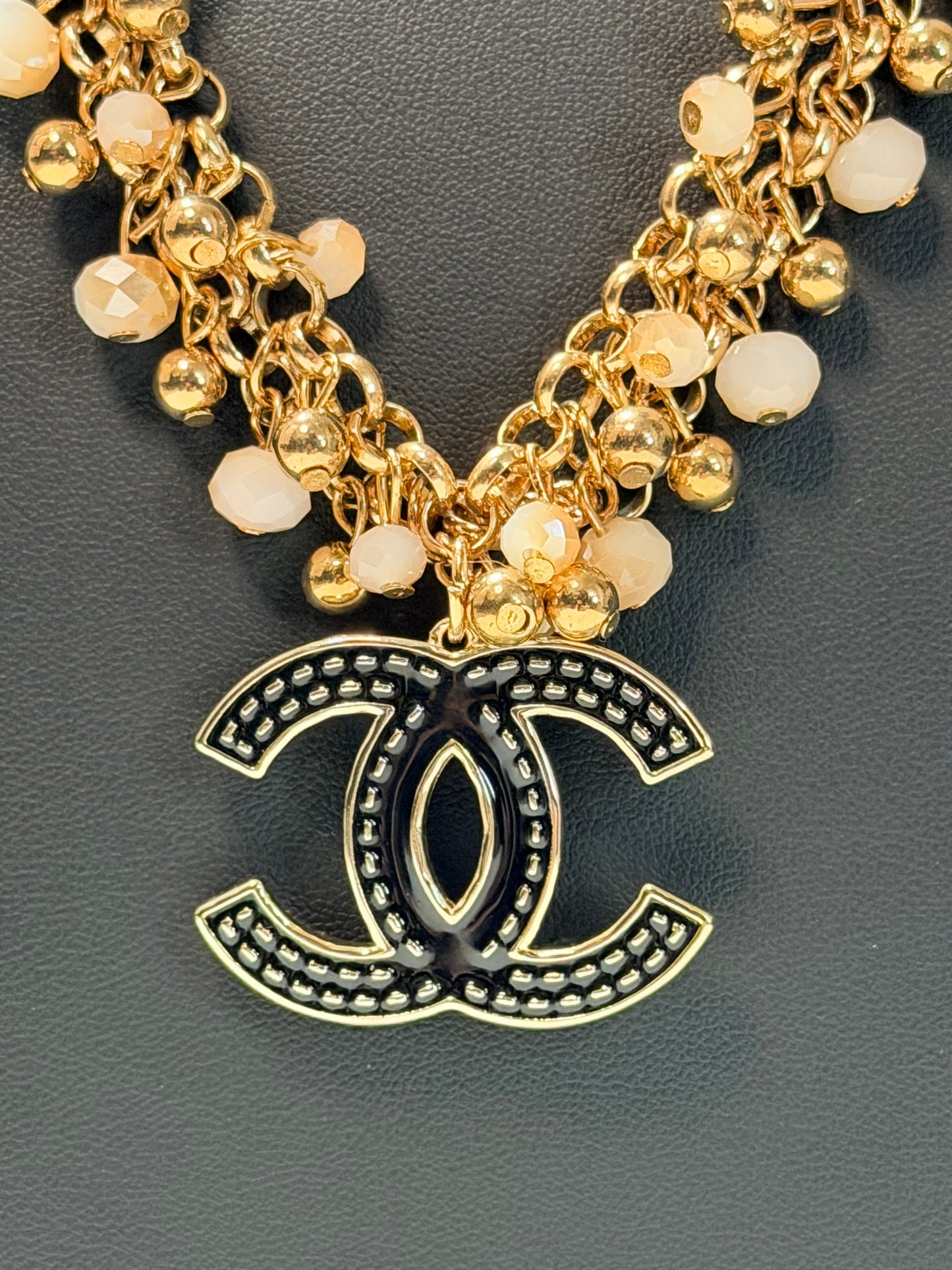 Black and gold CC necklace