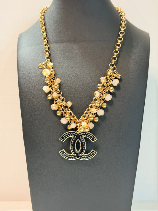 Black and gold CC necklace