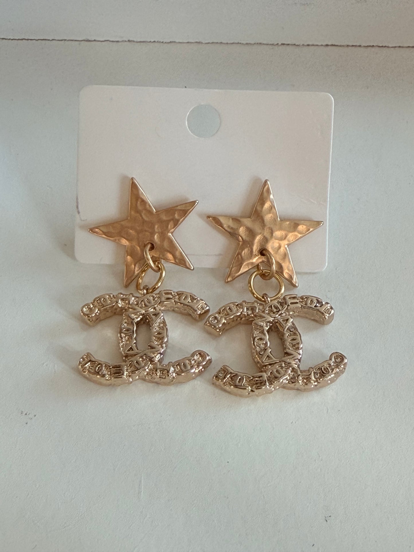 CC star earrings