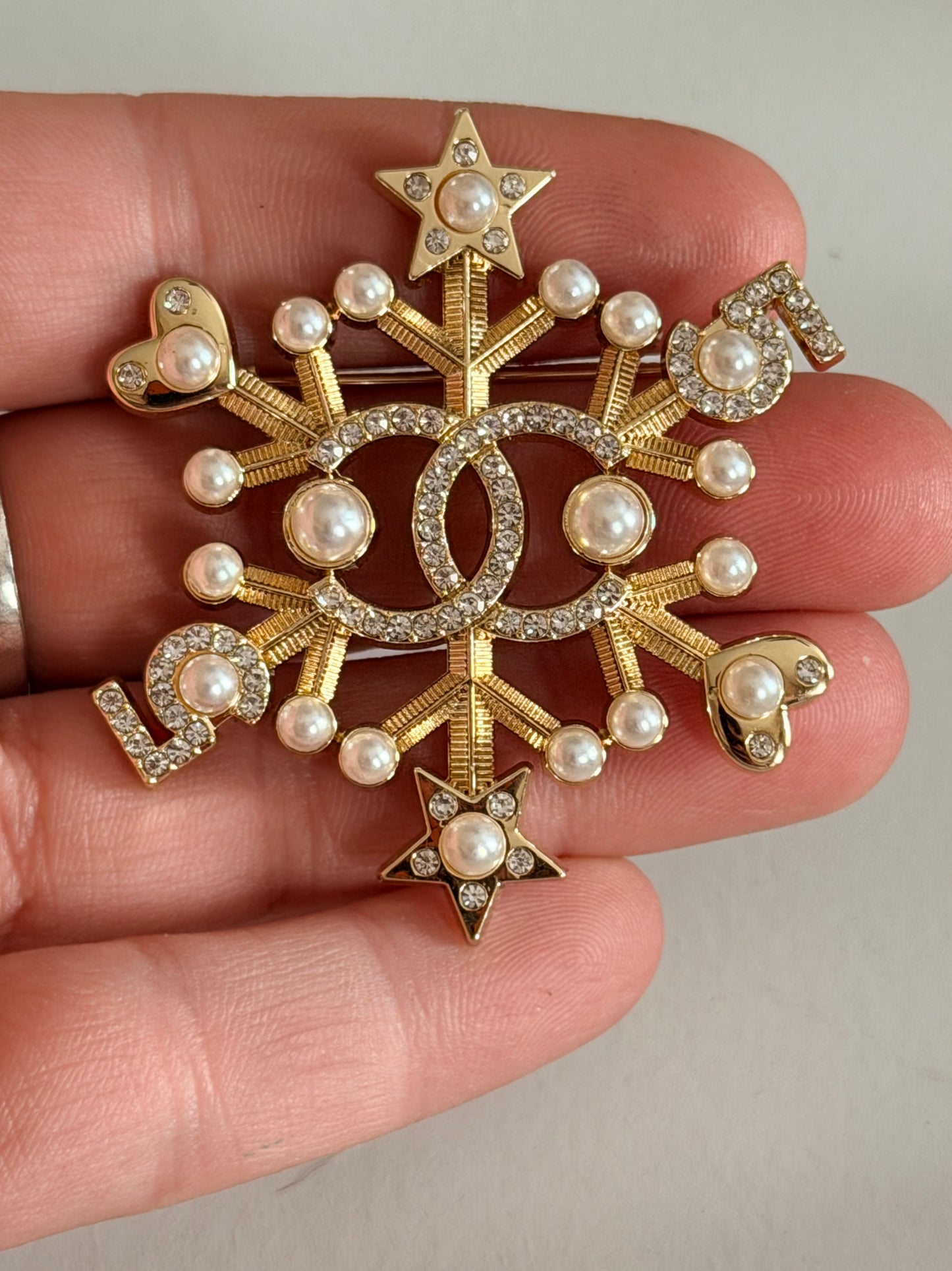 CC snowflake brooch