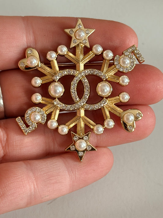 CC snowflake brooch